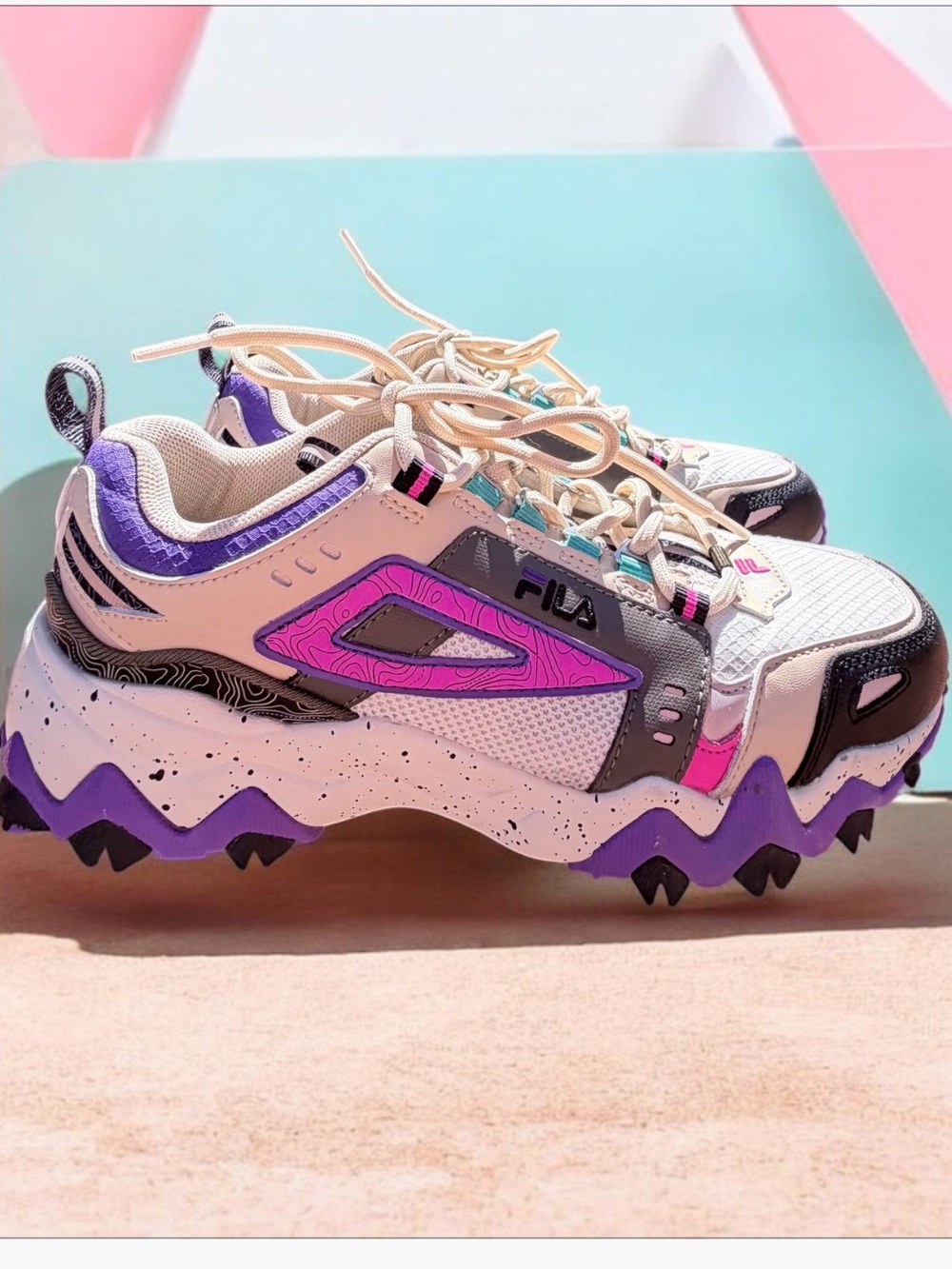 Fila Women's Oakmont TR Sneakers in the Gardenia/Thyme/Electric Purple colorway.
